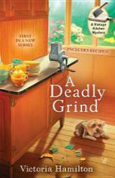 A Deadly Grind (A Vintage Kitchen Mystery) by Victoria Hamilton Paperback Book