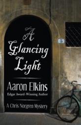 A Glancing Light (The Chris Norgren Mysteries) (Volume 2) by Aaron Elkins Paperback Book