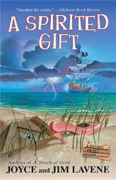 A Spirited Gift (A Missing Pieces Mystery) by Joyce And Lavene Paperback Book