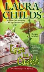 Eggs in a Casket (A Cackleberry Club Mystery) by Laura Childs Paperback Book