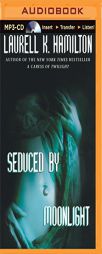 Seduced by Moonlight (Meredith Gentry Series) by Laurell K. Hamilton Paperback Book