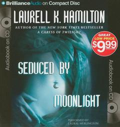 Seduced by Moonlight (Meredith Gentry Series) by Laurell K. Hamilton Paperback Book